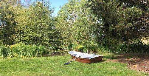 row boat sitting on the grass