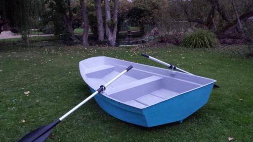 row boat on the grass