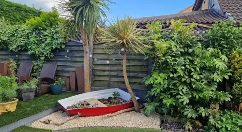 red-garden-boat-planter