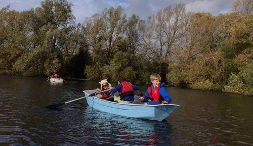 Kids loving being on the water in a row boat